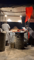 Evening food stall operates in Kandahar neighborhood
