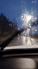 Driver records wet evening road conditions in Chaikovsky, Russia