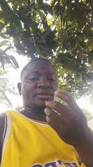 Man eating meals outdoors in Akwanga, Nigeria