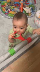 Baby Victor plays in playpen during supervised playtime