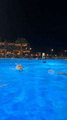 Evening swimmers enjoy illuminated pool in Nizhnekamsk, Russia