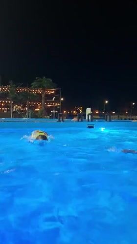 Evening swimmers enjoy illuminated pool in Nizhnekamsk, Russia