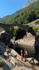 Summer afternoon at Verzasca's emerald river and stone bridge