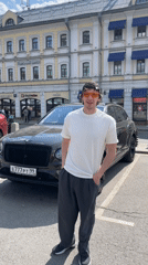 Man with orange sunglasses spotted near luxury SUV in Moscow