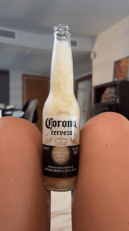 Cold Corona with a foamy head, Ibiza indoor setting.
