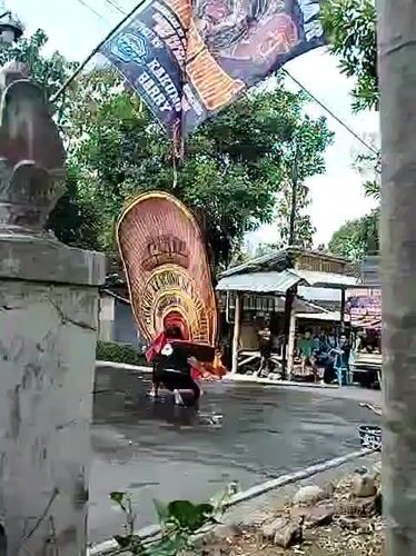 Traditional street performance with lion dance and martial arts in Mojogedang