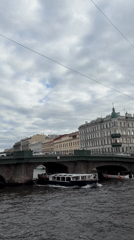 Canal boat and overcast streets in central Saint Petersburg