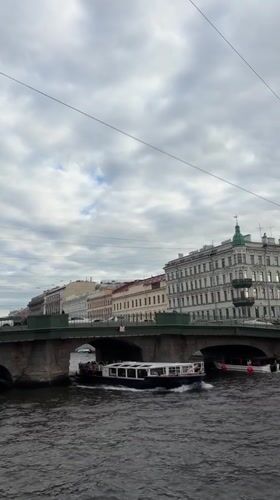 Canal boat and overcast streets in central Saint Petersburg