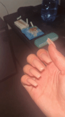 Person with distinctive acrylic nails documented in Varna, Bulgaria