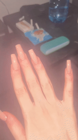 Person with distinctive acrylic nails documented in Varna, Bulgaria