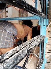 Two men observed in elevated space in Jenawi, Indonesia