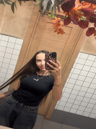 Young women document cafe visit, selfies in Izhevsk