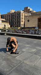 Skateboarders practice tricks at Barcelona plaza