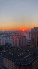 Surgut summer sunset, captured from above and street level