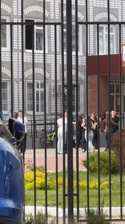 Teenagers gather outside building in Tolyatti, Russia