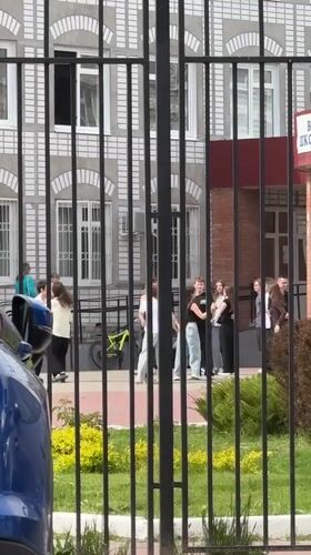 Teenagers gather outside building in Tolyatti, Russia