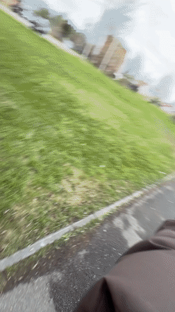 Woman walks through park in Reshetnikovo, Russia