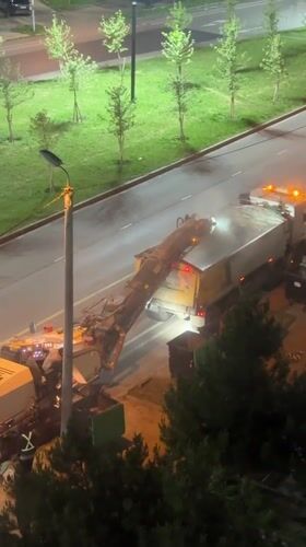 Nighttime road milling operation documented in Tbilisi, Georgia