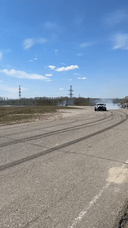 Early morning street racing gathering draws crowds in Chigiri, Russia