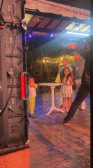 Children's nighttime stage performance captured in Porlamar, Venezuela