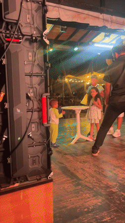 Children's nighttime stage performance captured in Porlamar, Venezuela