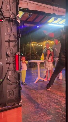 Children's nighttime stage performance captured in Porlamar, Venezuela