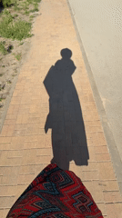 Person walks outdoors on sunny day in Anapa, Russia