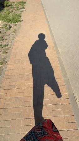 Person walks outdoors on sunny day in Anapa, Russia
