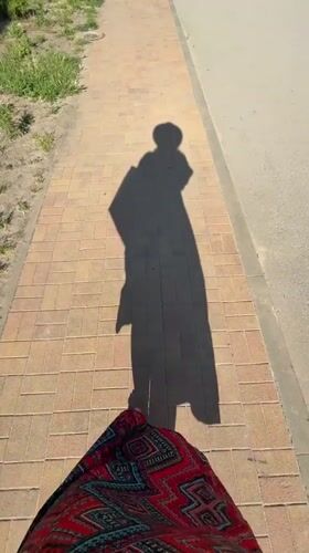 Person walks outdoors on sunny day in Anapa, Russia