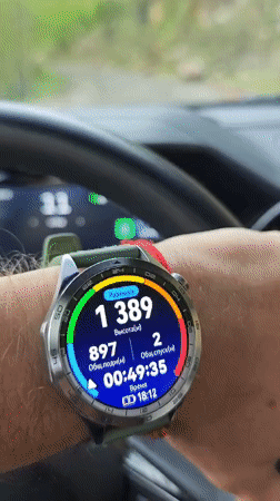 Hiker checks smartwatch altitude metrics during mountain climb in Abkhazia