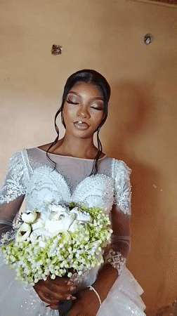 Bride in white dress filmed in Nigeria village