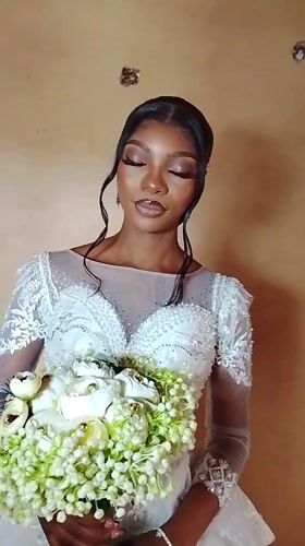 Bride in white dress filmed in Nigeria village