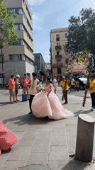 Traditional procession with ceremonial dress winds through Barcelona streets