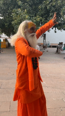 Sadhu at Pushkar Lake ghats during a warm July sunset