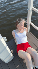 Woman enjoys afternoon fishing session on Russian pier