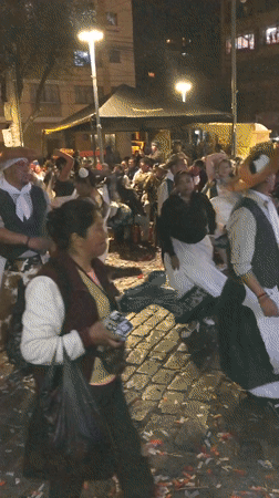 Late-night street festival in La Paz with dancers, bands, and performers
