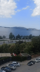 Airplane over stormy skies above Pendik's coastline
