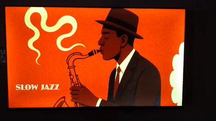 Television displays retro jazz poster in decorated interior space