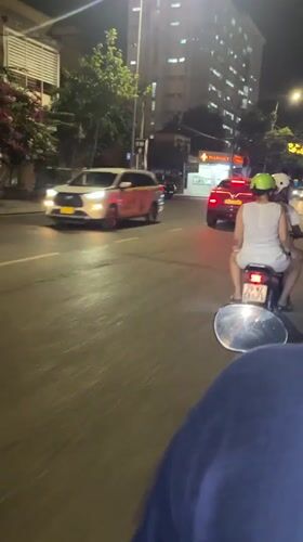 Evening traffic flows through busy Nha Trang streets