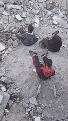 Children play amid rubble in Khan Yunis streets