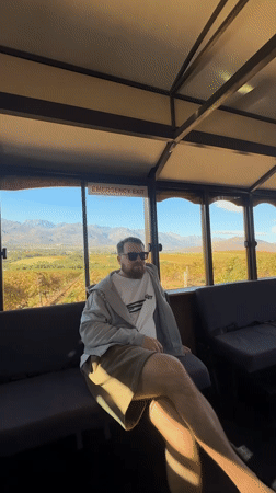 Man observed gazing out window in Stellenbosch building
