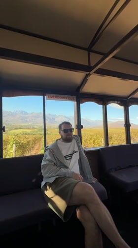 Man observed gazing out window in Stellenbosch building