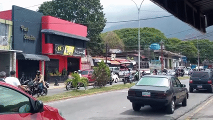 Motorcycles travel busy street in El Limon, Venezuela