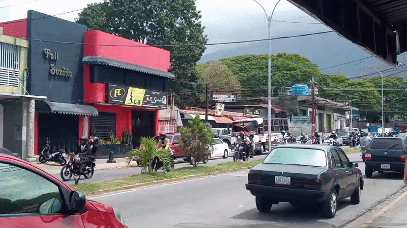 Motorcycles travel busy street in El Limon, Venezuela