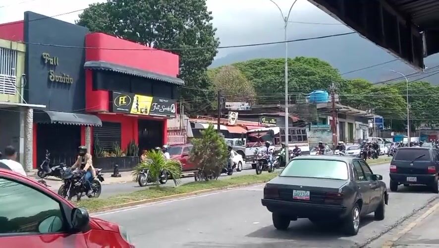 Motorcycles travel busy street in El Limon, Venezuela