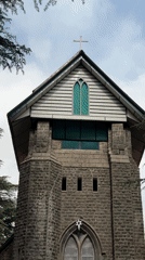 Tourists explore historic St. John in Wilderness Church, Dharamkot