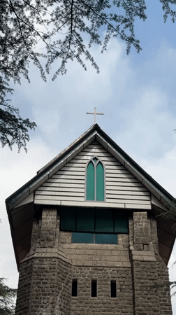 Tourists explore historic St. John in Wilderness Church, Dharamkot