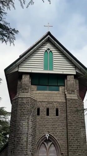 Tourists explore historic St. John in Wilderness Church, Dharamkot