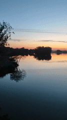 Bronnitsy at golden hour: pond, park, and church at dusk