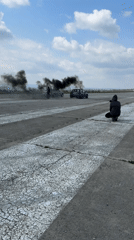 Cars perform burnouts on abandoned Bulgarian airstrip